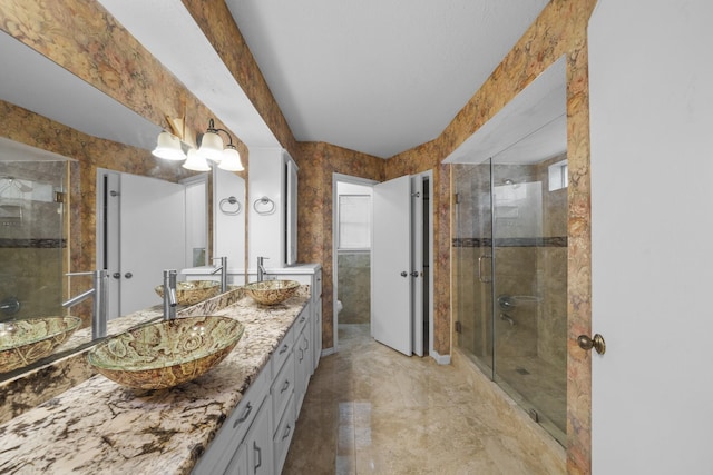 bathroom with vanity, toilet, and walk in shower