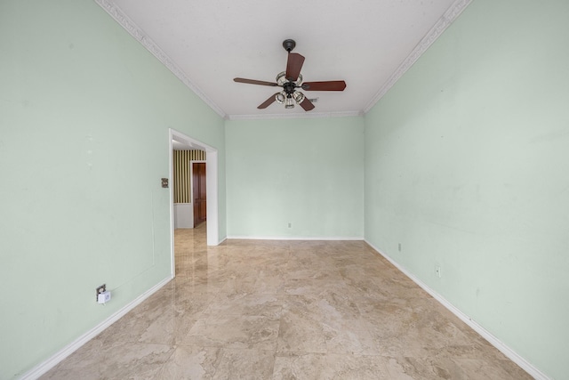 empty room with ceiling fan and crown molding