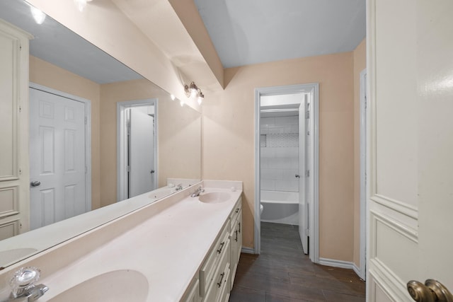 bathroom with hardwood / wood-style floors and vanity