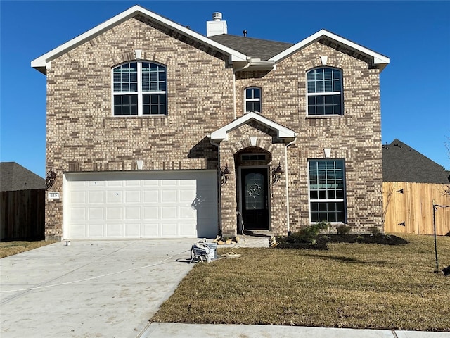 view of front property with a front yard and a garage