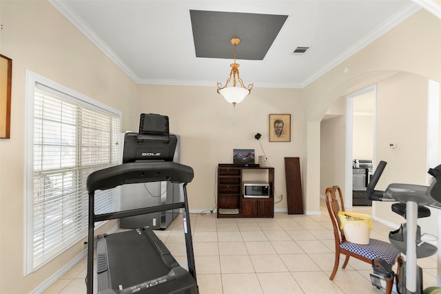 exercise room featuring light tile patterned flooring and ornamental molding