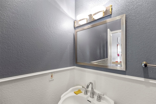 16004 Penick Rd, Waller, TX 77484 - bathroom with a sink and a textured wall