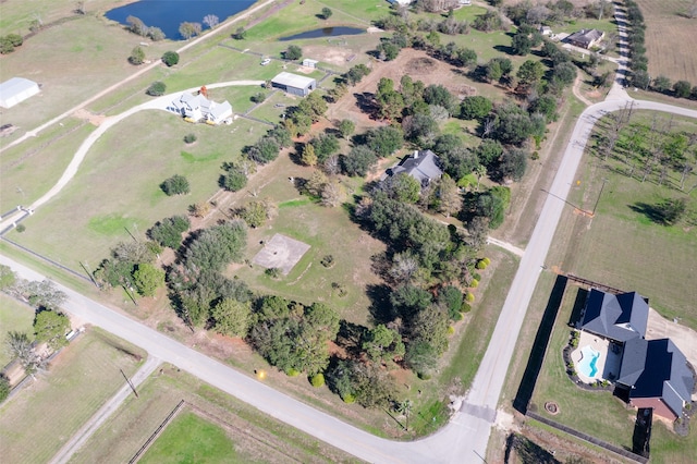 birds eye view of property with a rural view