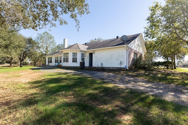 16004 Penick Rd, Waller, TX 77484 - view of front of property featuring a chimney and a front yard