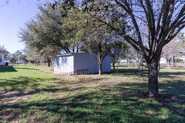 16004 Penick Rd, Waller, TX 77484 - view of green lawn with an outbuilding