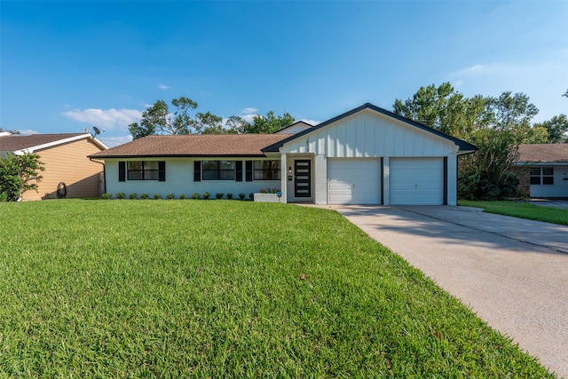 ranch-style home featuring a front lawn and a garage