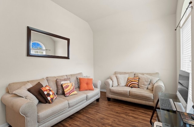 living room featuring dark hardwood / wood-style floors and lofted ceiling