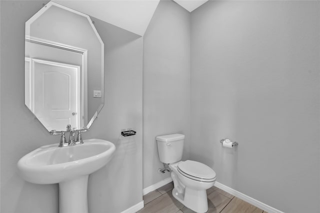 bathroom with tile patterned flooring and toilet