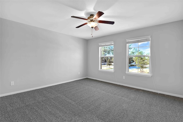 spare room featuring ceiling fan and carpet floors