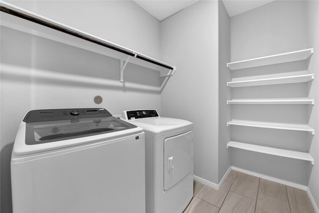 laundry room with washer and clothes dryer