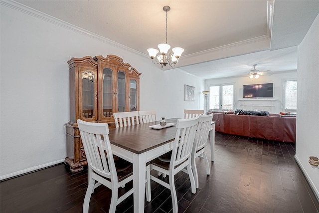 dining area featuring crown molding, ceiling fan with notable chandelier, and dark hardwood / wood-style floors