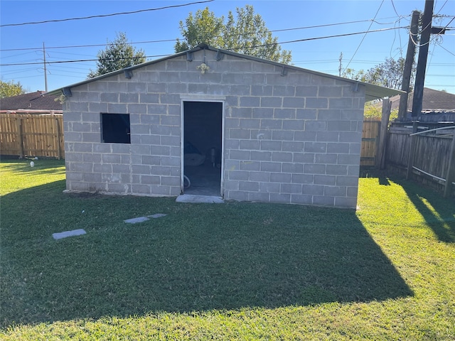 view of outbuilding featuring a yard