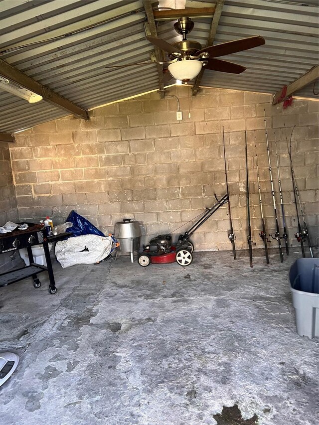 interior space with ceiling fan and vaulted ceiling