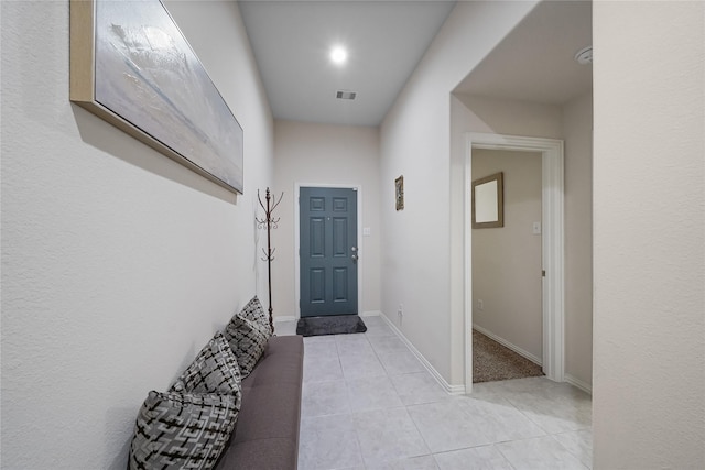 hallway featuring light tile patterned floors