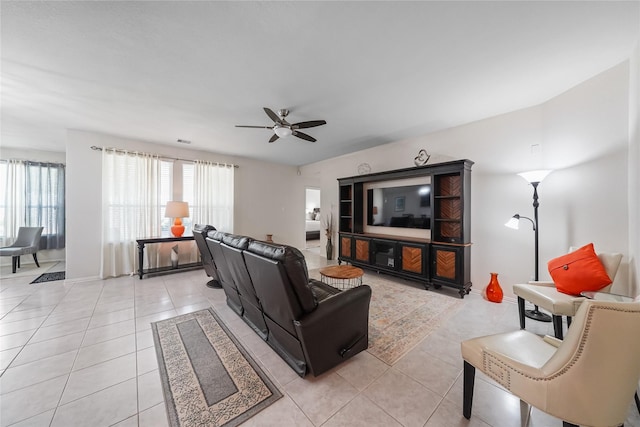 living room featuring ceiling fan and light tile patterned flooring