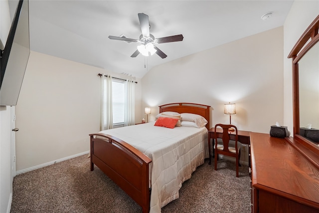 bedroom featuring ceiling fan, vaulted ceiling, and dark colored carpet