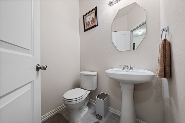 bathroom featuring toilet