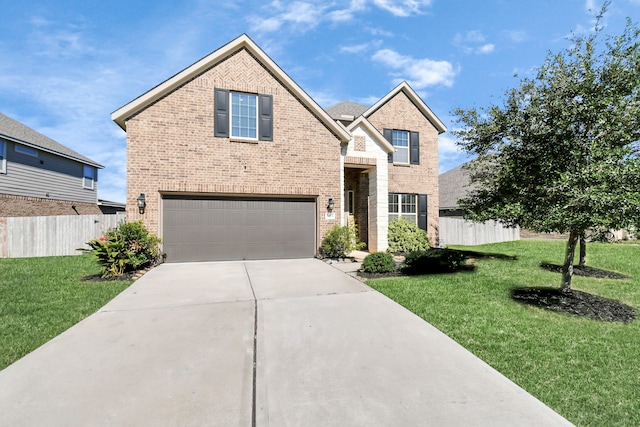 view of front of house featuring a front yard and a garage