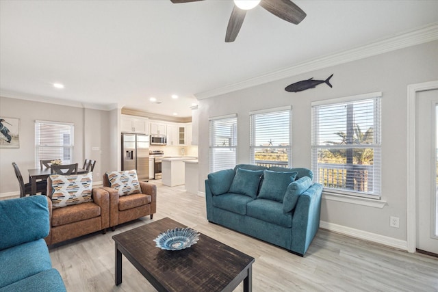 living room featuring light hardwood / wood-style flooring, ceiling fan, and crown molding