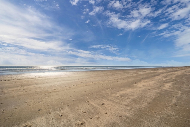 view of water feature with a beach view