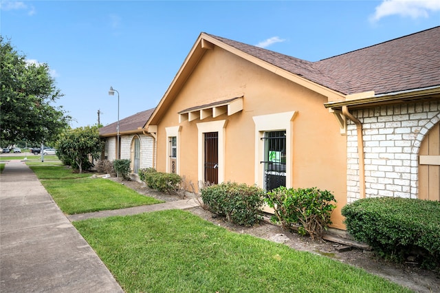 view of home's exterior featuring a yard