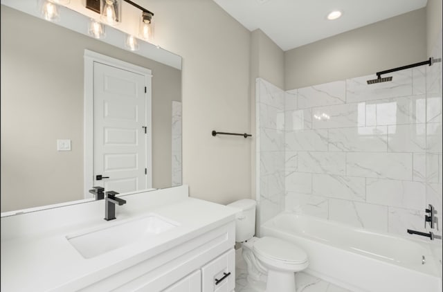 full bathroom featuring vanity, tiled shower / bath combo, and toilet