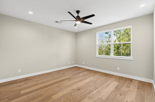 unfurnished room featuring light hardwood / wood-style floors and ceiling fan