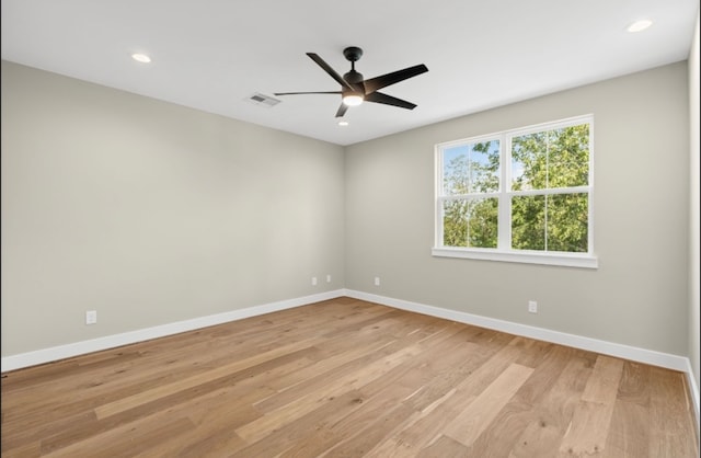 empty room with light hardwood / wood-style flooring and ceiling fan