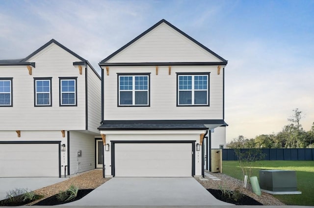 view of front of home featuring a garage and a front lawn