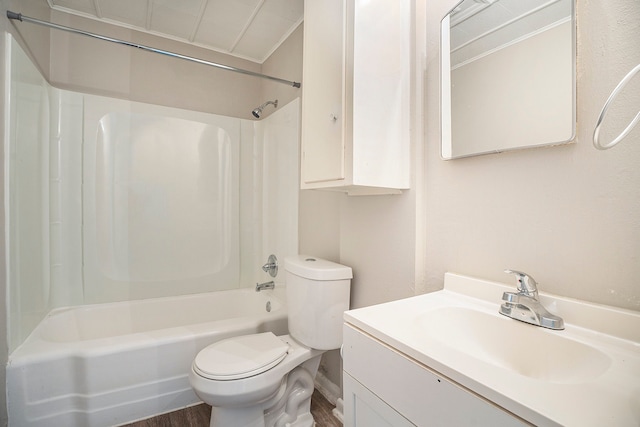 full bathroom featuring hardwood / wood-style floors, vanity, toilet, and bathing tub / shower combination