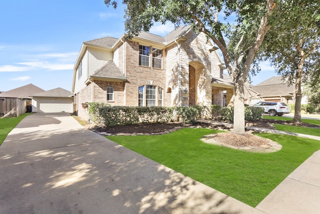 view of front of house featuring a front yard and a garage