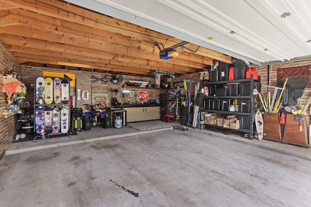 garage featuring a workshop area and a garage door opener