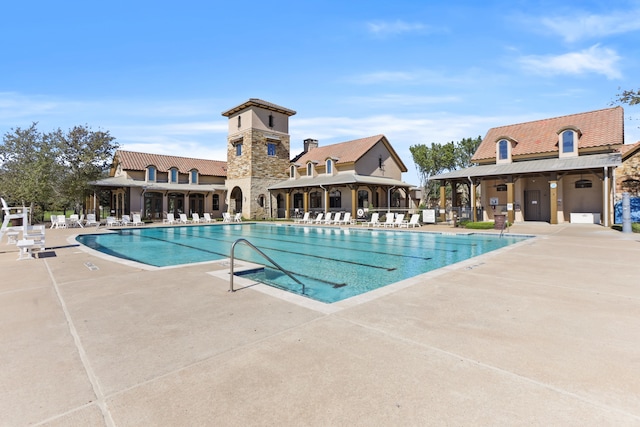 view of swimming pool with a patio area