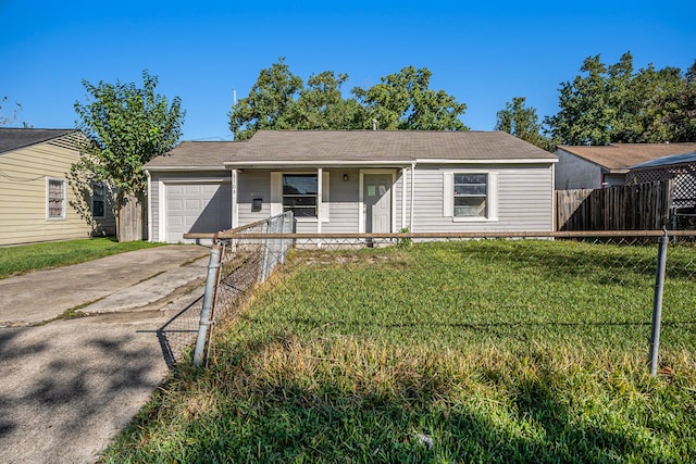 ranch-style house featuring covered porch, a garage, and a front lawn