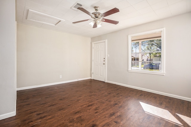 unfurnished room with dark hardwood / wood-style flooring and ceiling fan