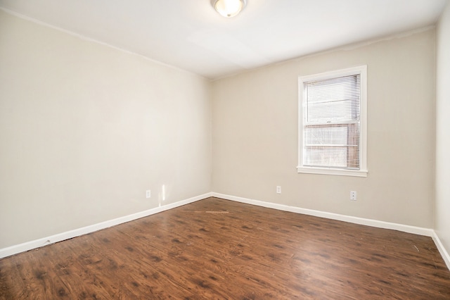 unfurnished room featuring dark wood-type flooring