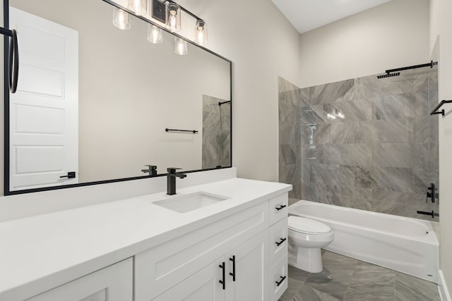 full bathroom featuring vanity, tiled shower / bath combo, and toilet