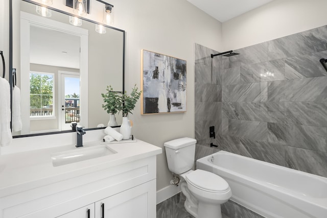 full bathroom featuring vanity, toilet, and tiled shower / bath