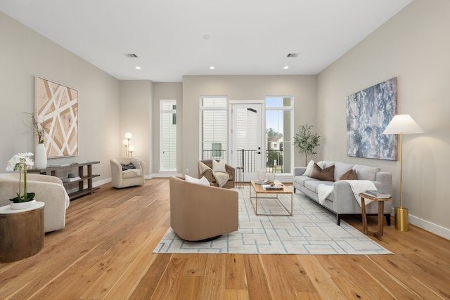 living room with light hardwood / wood-style floors