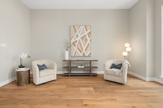 sitting room with light hardwood / wood-style flooring