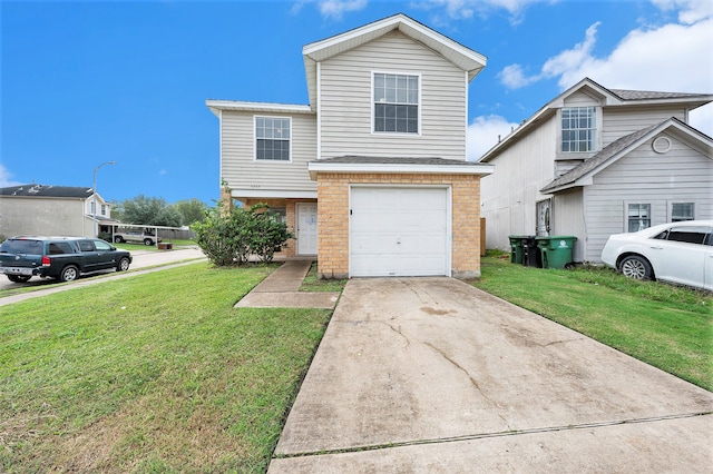 view of front of home with a front lawn and a garage