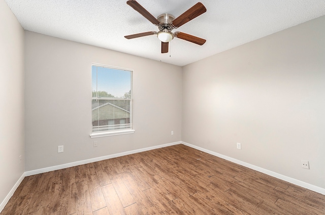 spare room with a textured ceiling, hardwood / wood-style flooring, and ceiling fan