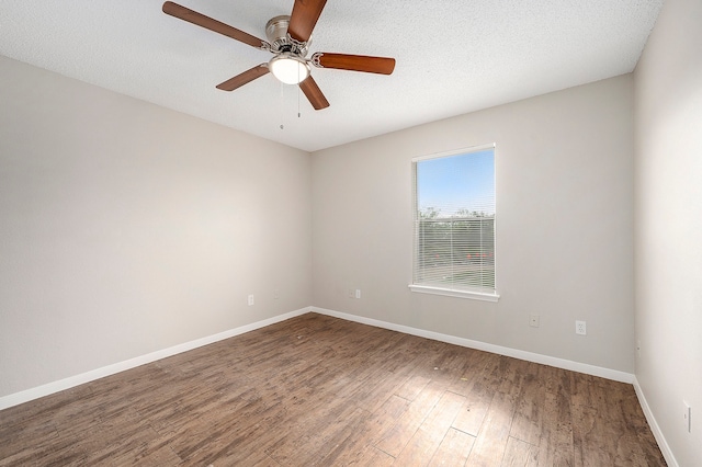 unfurnished room featuring ceiling fan, wood-type flooring, and a textured ceiling