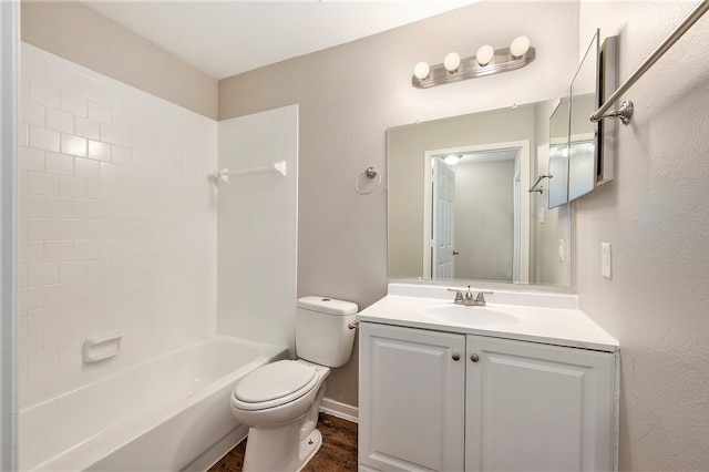 full bathroom with hardwood / wood-style floors, vanity, toilet, and shower / washtub combination