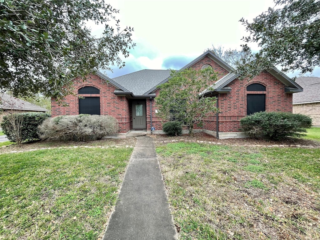 view of front of home with a front yard