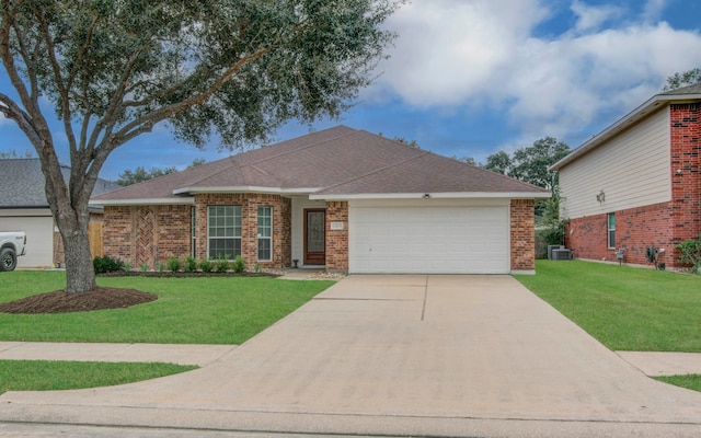 view of front facade with cooling unit, a front lawn, and a garage