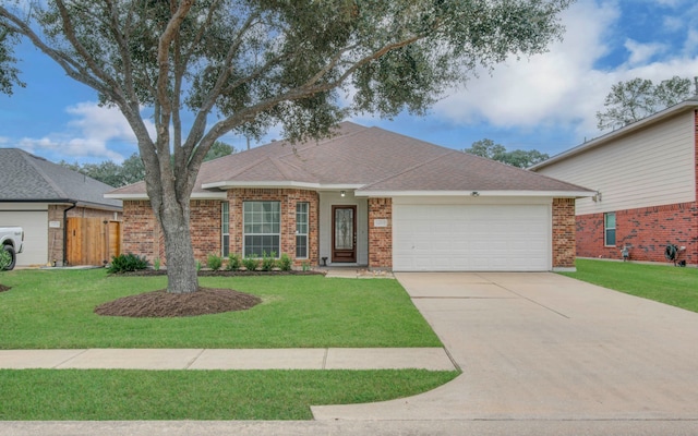 ranch-style home with a garage and a front lawn