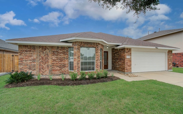 ranch-style house featuring a front yard and a garage