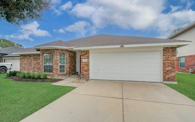 ranch-style house with a garage and a front lawn