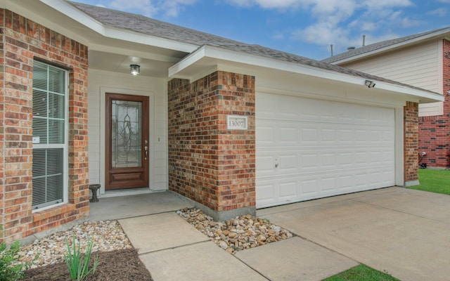 entrance to property featuring a garage